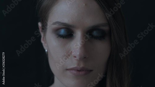 Wallpaper Mural Portrait of a beautiful woman on a black background. Model with bright makeup. Female smiles. Smokey eyes. She opens her eyes. Torontodigital.ca