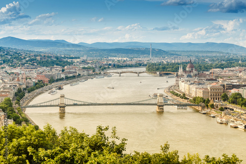 cityscape view of Danube river with different ships in Budapest