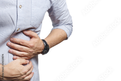 Man suffering from stomach ache, isolated on white background photo