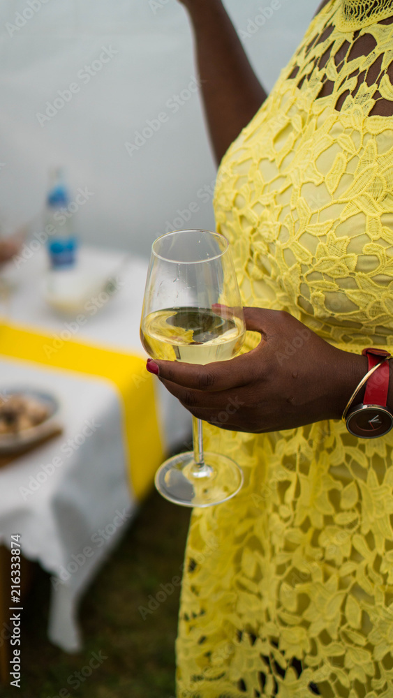 African-american woman holding a glass of wine African-american woman holding a glass of wine