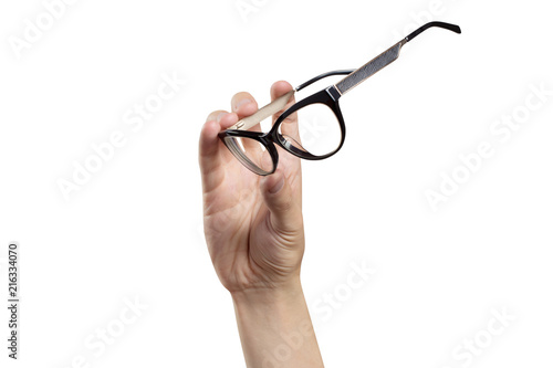Hand holding plastic black glasses, isolated on white background