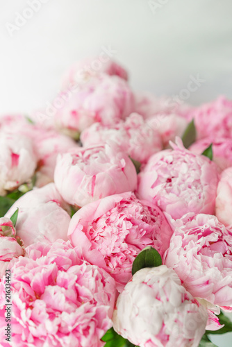 Fototapeta Naklejka Na Ścianę i Meble -  pink peonies . Floral composition, daylight. Wallpaper. Lovely flowers in glass vase. Beautiful bouquet