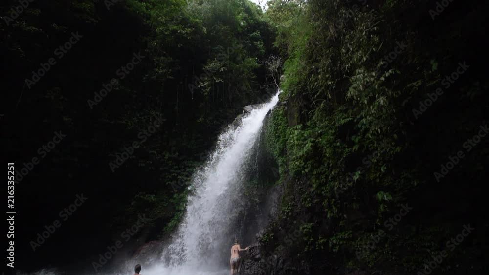 Swimming in a waterfall in the jungle - Indonesia Swimming in a waterfall in the jungle - Indonesia