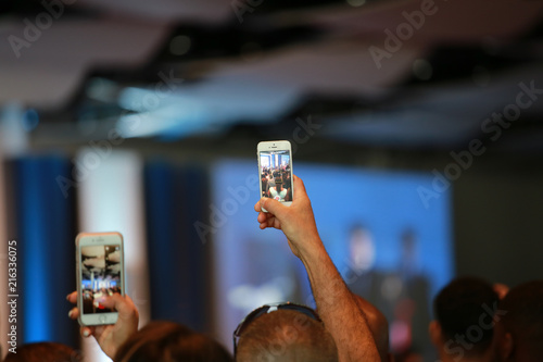 people photographing an event with the smartphone