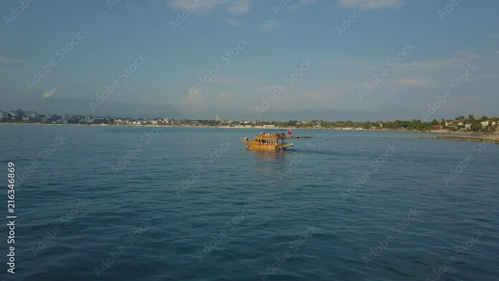 The flight of the drones following the boat to the sea. In the distance you can see the shore. The flight of the drones following the boat to the sea. In the distance you can see the shore.