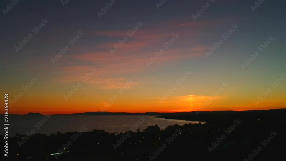 The golden hour, after the sun has fallen over the Atlantic Ocean the sky changes to deep hues of blue and orange revealing the coastlines of Africa and Europe. The golden hour, after the sun has fallen over the Atlantic Ocean the sky changes to deep hues of blue and orange revealing the coastlines of Africa and Europe.