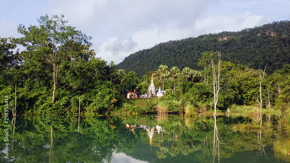 Landscape Photography of A White Myanmar Style Pagoda / Temple in A Beautiful Environment of Lake, Forest, and Mountains in Ywathit Subtownship, Kayah State, MYANMAR.