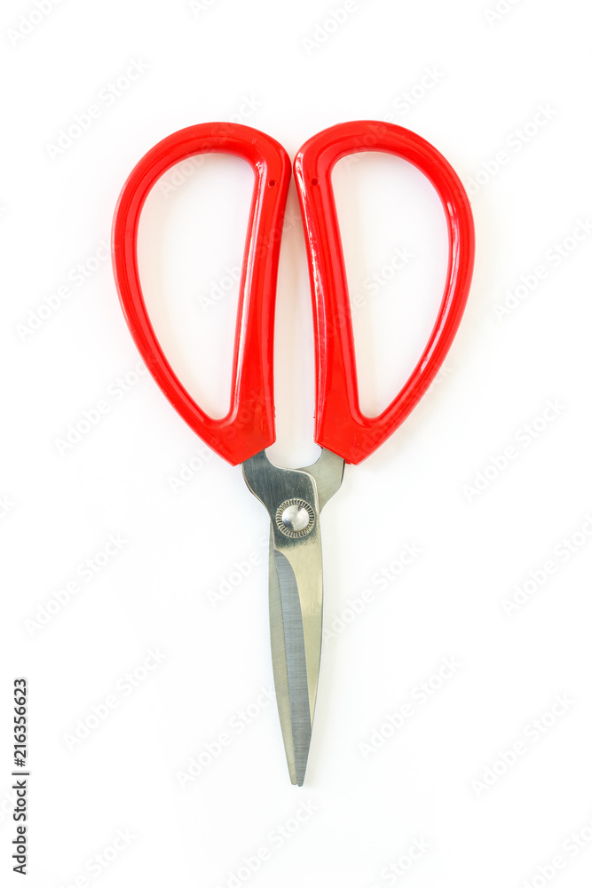 red scissors cutting on white background red scissors cutting on white background