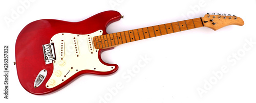 Fotografia, Obraz Red electric guitar with white backdrop.