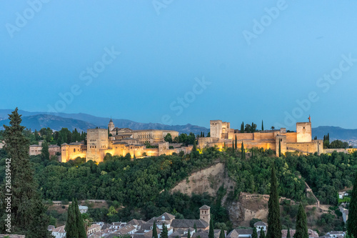 The magnificient Alhambra of Granada, Spain. Alhambra fortress at sunset viewed from Mirador de San Nicolas. © SkandaRamana