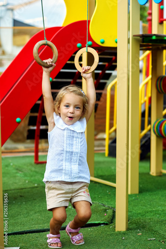 Portrait of a little girl dressed up on the Playground .Active children's rest © fisher05