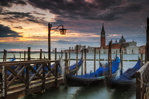 Gondolas docked with the island of San Giorgio Maggiore in the background © Andrew S.