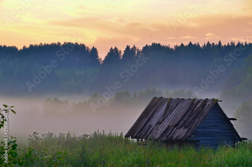 wooden house in fog
