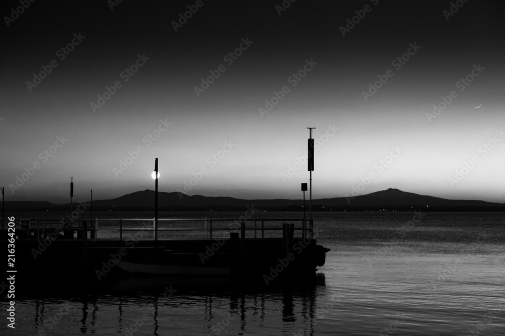 A pier at Trasimeno lake (Umbria, Italy) at dusk