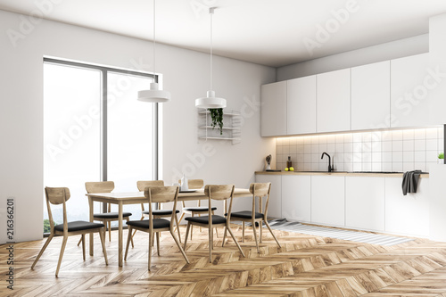 Gray chairs in a white kitchen corner