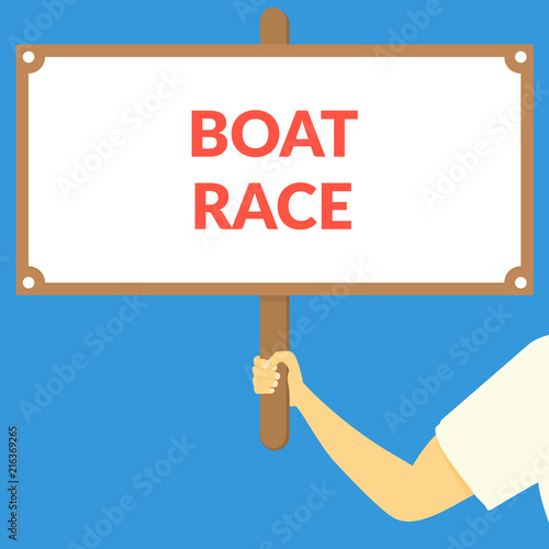 BOAT RACE. Hand holding wooden sign