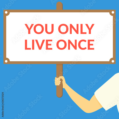 YOU ONLY LIVE ONCE. Hand holding wooden sign