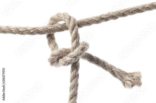 Close-up of a rope knot, isolated on white background