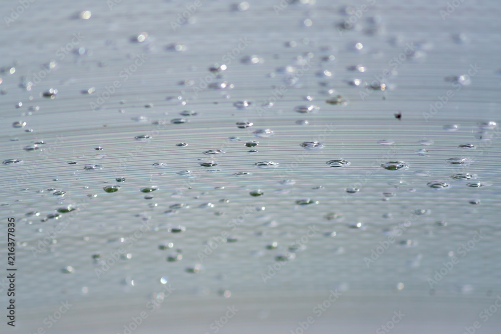 Transparent Polycarbonate plastic sheet with drops, background texture with space for text Transparent Polycarbonate plastic sheet with drops, background texture with space for text