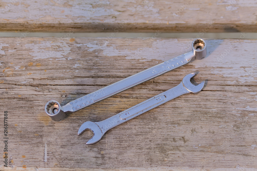 two metal wrenches on wooden background. Set of worktools for maintenance and repair two metal wrenches on wooden background. Set of worktools for maintenance and repair