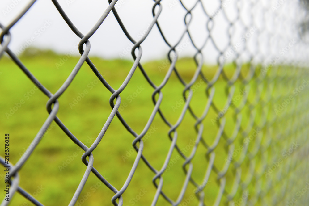 Fototapeta premium Steel fence around the field