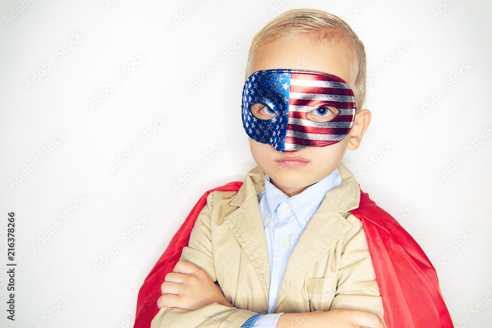 Cute little boy wearing a flag mask and superhero cape Cute little boy wearing a flag mask and superhero cape