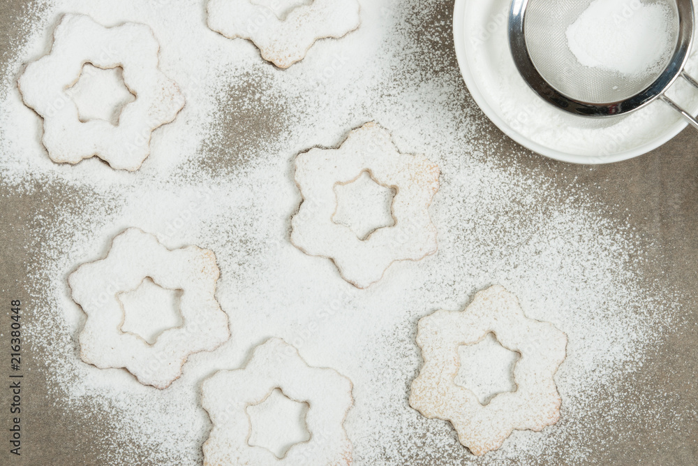 Homebaked Christmas Star Cookies, Icing Sugar. Decorating Process. Homebaked Christmas Star Cookies, Icing Sugar. Decorating Process.