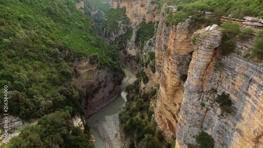 Aerial Drone of Albania Canyon Osum. Beautiful trees and river in-between of huge mountains with a lot fo greenery around. Aerial Drone of Albania Canyon Osum. Beautiful trees and river in-between of huge mountains with a lot fo greenery around.