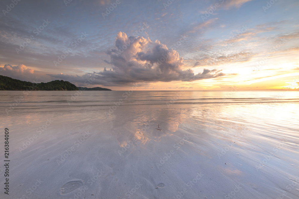 sunset seascape with reflection. soft focus due to long expose.