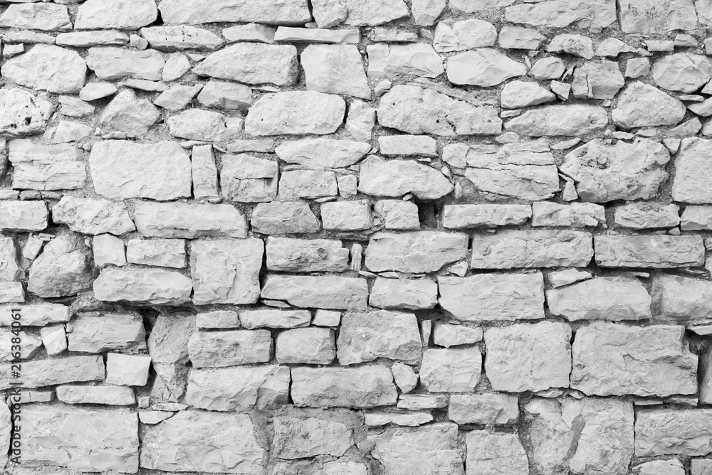 Fototapeta premium Old stone wall surface as background, wallpaper.
