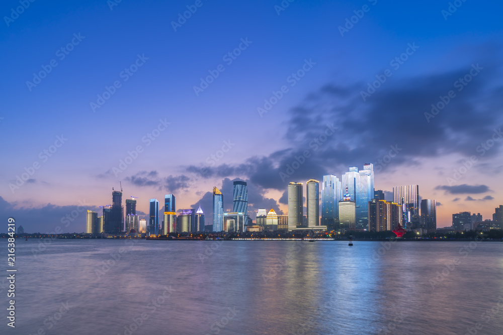 The night scene of modern urban architectural landscape in Qingdao, China The night scene of modern urban architectural landscape in Qingdao, China