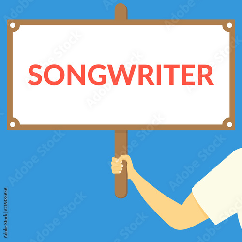 SONGWRITER. Hand holding wooden sign