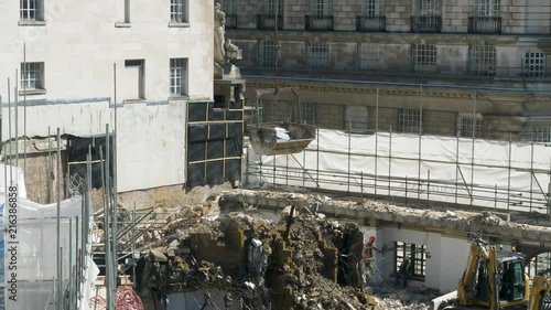 Crane lift UP of skip on Ergon House in Millbank, London photo