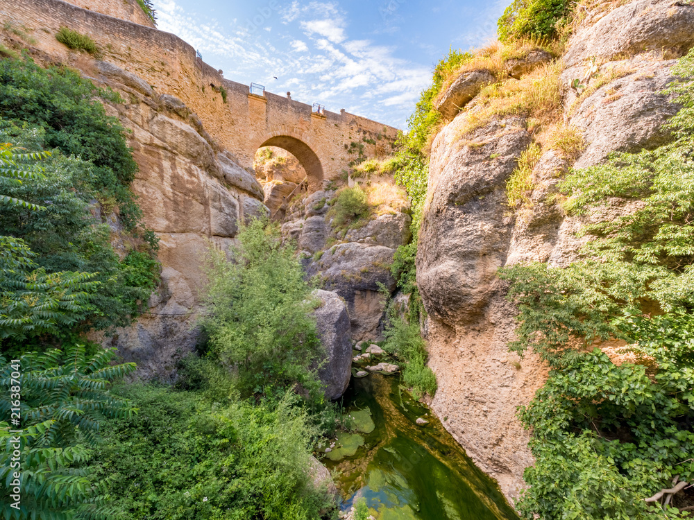 Puente viejo, the old roman bridge over Guadalevin river in the ancient city of Ronda, Spain