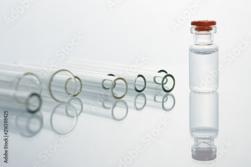 Group of vials with medication on blue methacrylate table. photo