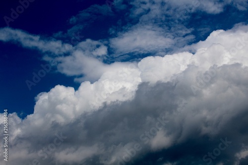 Fototapeta Naklejka Na Ścianę i Meble -  The fluffy puffy white clouds in the sky.