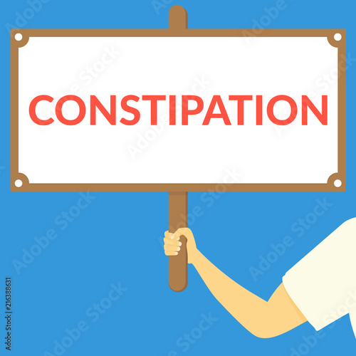 CONSTIPATION. Hand holding wooden sign