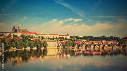 Prague, capital of the Czech Republic. Scenic sunset view of the Old Town pier architecture and Charles Bridge over Vltava river. © montypeter