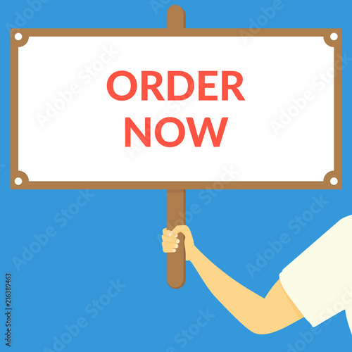 ORDER NOW. Hand holding wooden sign