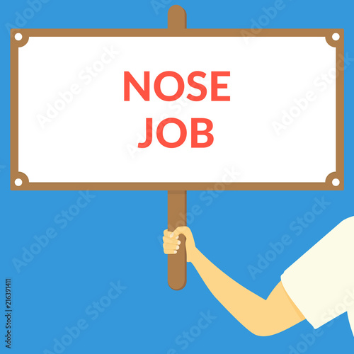 NOSE JOB. Hand holding wooden sign