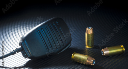 Pistol ammo and microphone photo