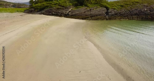 Ocean waces hitting a beach in Norway photo