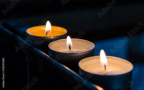 Three Burning Candles in Line