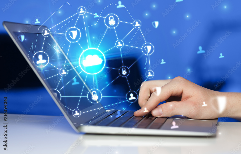 Hand using laptop with centralized cloud computing system and network security concept
Hand using laptop with centralized cloud computing system and network security concept