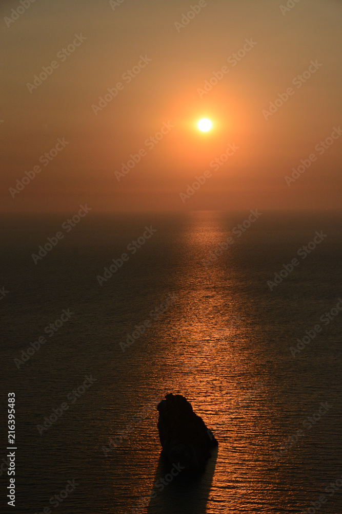 Sunset in Sardinia/Romantic sunset in which a rock is highlighted by solar rays