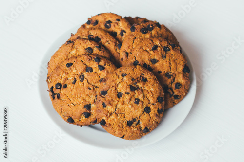 Chocolate cookies of on a plate on a white background
