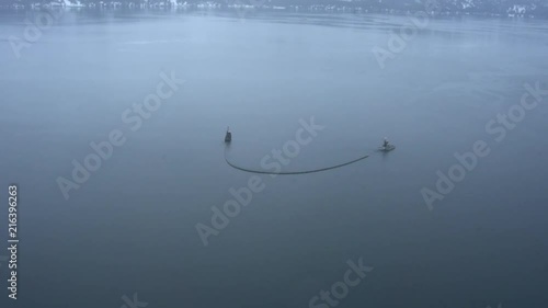 Two fishing boats pulling a boom in an oil spill training exercise, photo