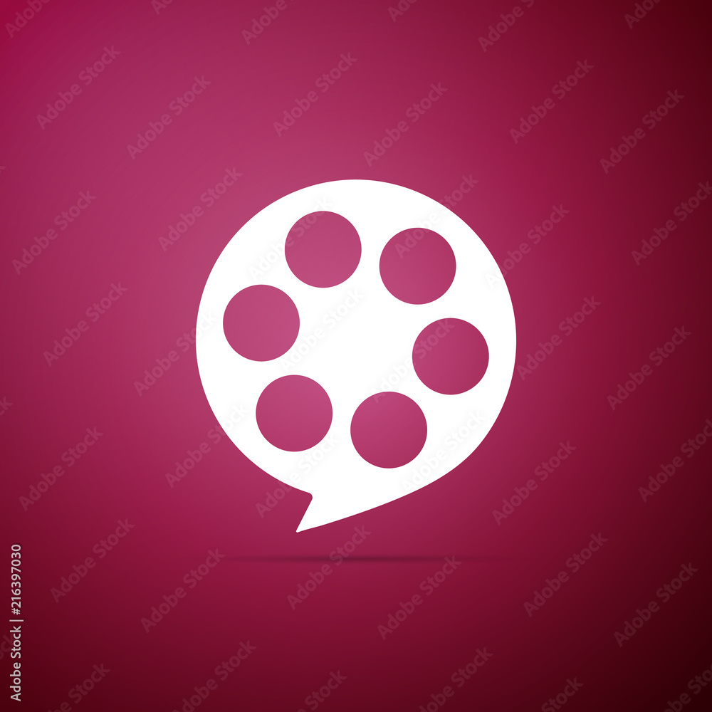 Film reel icon isolated on purple background. Flat design. Vector Illustration