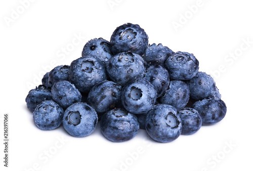 Group of fresh blueberries with leaves isolated on white background