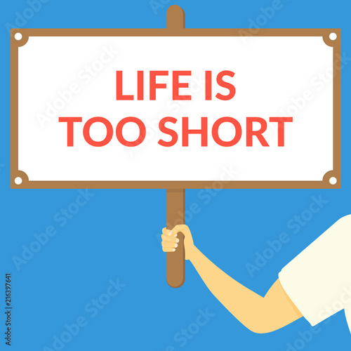 LIFE IS TOO SHORT. Hand holding wooden sign